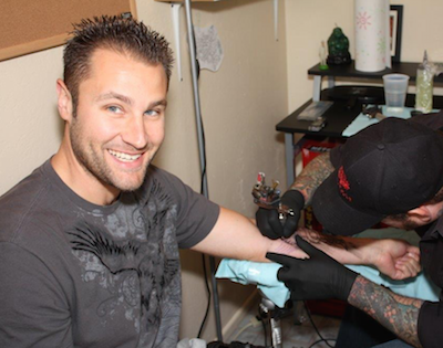 Ryan getting a recent tattoo