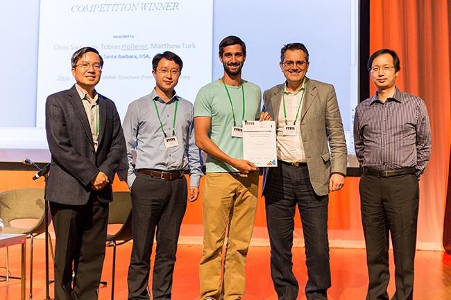 Chris, center, accepting the top prize for Open-Source Software at the 2015 ACM Multimedia Conference in Brisbane, Australia. Photo courtesy of Chris Sweeney